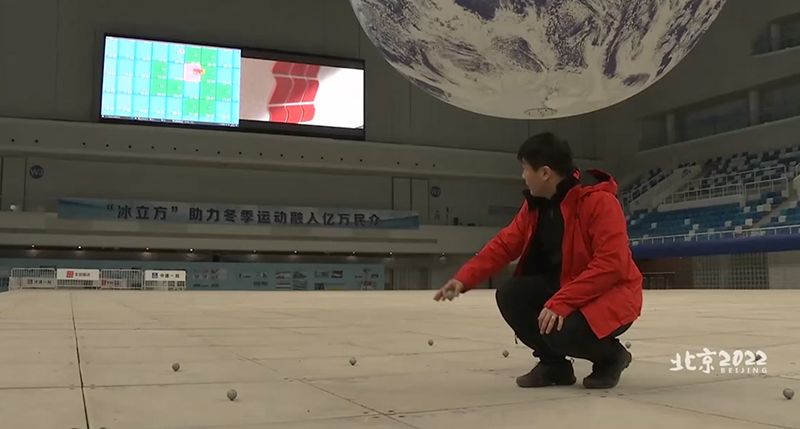 The staff uses the motion capture system to level the motion capture marking points on the ground of the Winter Olympics