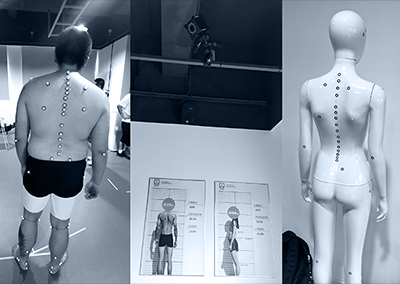 A person with markers attached collects posture data under a motion capture camera